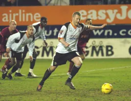 Kevin Nicholls scores the late penalty