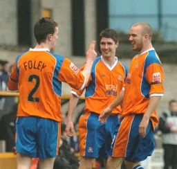 Kevin Foley is congratulated after giving the Town an early lead