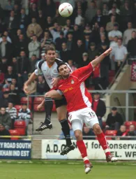 Chris Coyne rises to head the winner