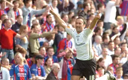 Ahmet Brkovic arms aloft celebrates his goal