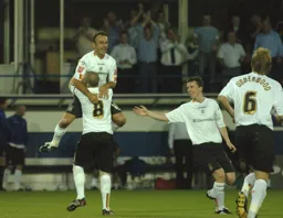 Ahmet Brkovic lifted up by Kevin Nicholls to celebrate his goal