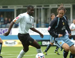 Enoch Showunmi controls the ball watched by a Leeds player