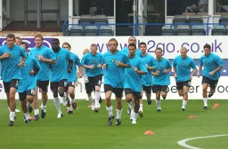 Luton players warm up in their centenary kit