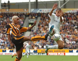 Dean Morgan battles for the ball with a Hull player