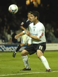 Stephen Robinson heads the ball