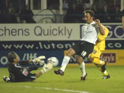Ahmet Brkovic tries to nudge the ball over the Preston goalkeeper