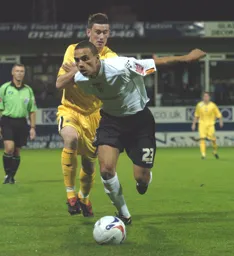 Dean Morgan evades a tackle and comes away with the ball