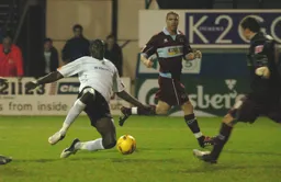 Enoch Showunmi lunges for the ball as the Burnley keeper prepares to strike it