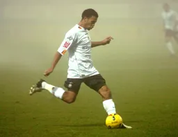 Carlos Edwards prepares to strike the ball