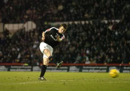 Kevin Foley strikes the ball