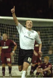 Warren Feeney points to the sky to celebrate his goal