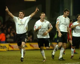 Stephen Robinson celebrates his goal arms aloft
