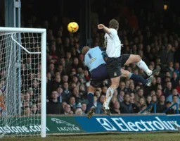Steven Howard leaps with the QPR goalkeeper