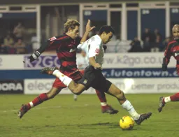 Carlos Edward strikes the ball