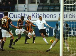 Dean Morgan shoots for goal