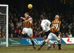 Keith Keane heads the ball goalward