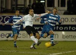 Dean Morgan kicks to score