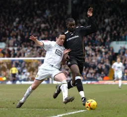 Enoch Showunmi challenges for the ball