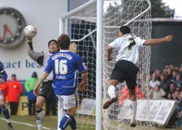 Carlos Edwards heads the ball across the six yard box