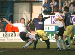 Steven Howard stretches and beats the Derby defender to the ball before scoring