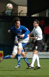Chris Coyne wins a header