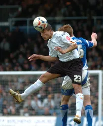 Dean Morgan wins a header