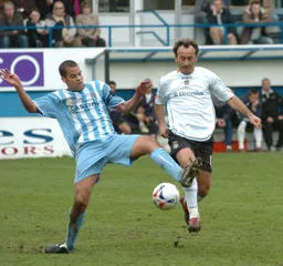 Ahmet Brkovic tries to control the ball as a Coventry player tackles
