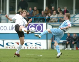 Marcus Heikkinen wins the ball as a Coventry player challenges