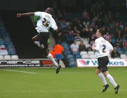 Leon Barnett celebrates after scoring the first goal