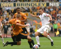 Sol Davis is closed down by two defenders