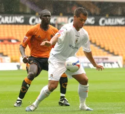 Lewis Emanuel holds off Seyi George Olofinjana