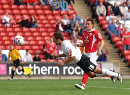 Ahmet Brkovic dives in to head in the late winner