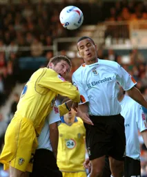 Dean Morgan wins a header