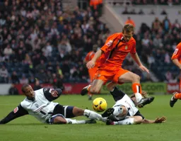 Rowan Vine hurdles over two fallen Preston defenders