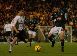 Steve Robinson and Gary Sawyer go for a fifty fifty ball