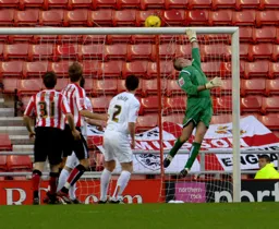 Dean Kiely tips a shot over the bar