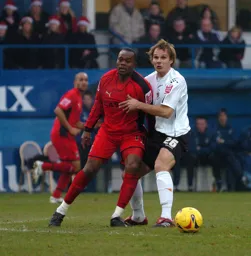 Markus Heikkinen grabs a hold of Stern John