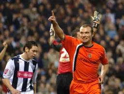 Warren Feeney looks pleased after scoring Town`s second goal