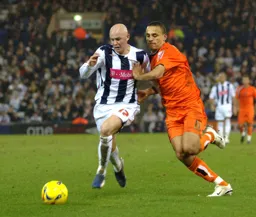 Dean Morgan and Richard Chaplow in a race for the ball