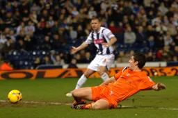 Steve Robinson slides in but just fails to make contact