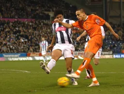 Dean Morgan`s run is hampered by former Hatter Curtis Davies