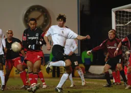 Russell Perrett joining the attack flicks the ball off