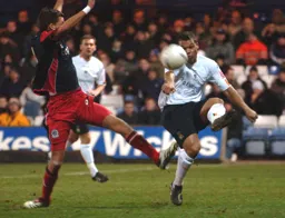 Lewis Emanuel clears the ball downfield
