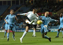 Dean Morgan hits a right foot volley