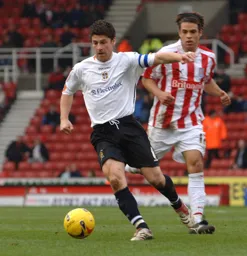 Steve Robinson moves forward with the ball