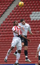 Matt Spring wins a header