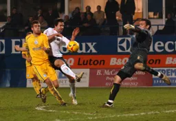 Adam Boyd tries to charge down Mark Crossley`s clearance