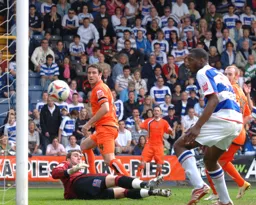 Chris Coyne watches as David Bell`s effort scores Town`s first goal