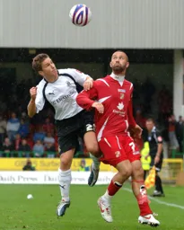 Paul McVeigh competing for a header