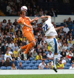 David Bell wins the header